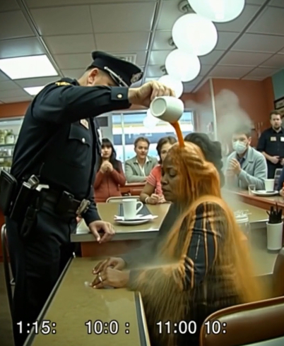 Racist Cop Pours Coffee On Quiet Middle Aged Black Woman Only To Fall To His